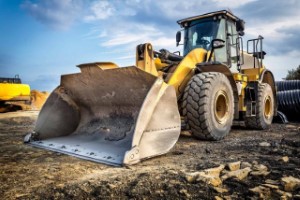 A bulldozer is parked on a construction site, showcasing diesel power.